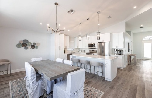 North Palm Beach Heights House | New On The Market! Newly Renovated 3BR/2BA Heated Pool & Screen Enclosure.