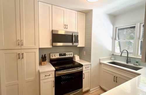 Sealoft Villas Cottage | New to Market. Golf & pond views. Refined beach cottage.