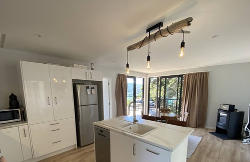 Tryphena House | Newly built 2 bedroom house with views and swimming beach 5 mins away