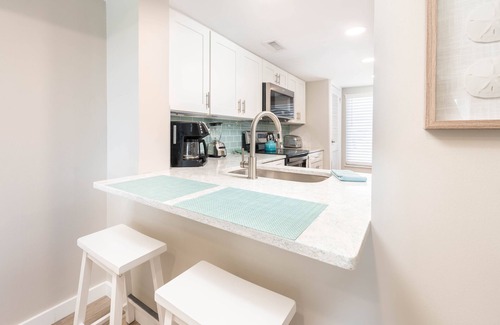 Oceanmarsh Subdivision Condo | Newly Listed Immaculate Condo - Distant Ocean Views - Pool and Beach Access