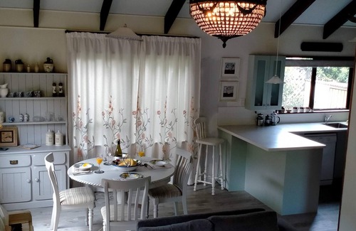 Akaroa House | Newly redecorated & beside th stream sunny seating area Spring is gorgeous here