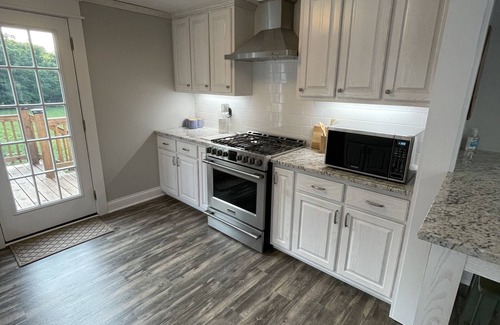 Albany House | Newly remodeled creekside farmhouse with a large back deck, 8 miles from Rowena.