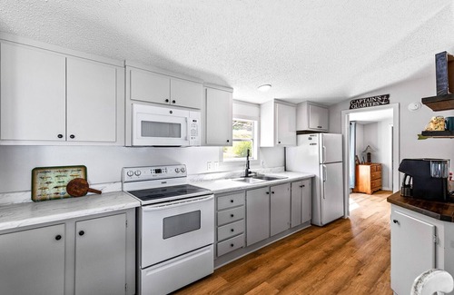 Downsville House | Newly renovated lakehouse sleeps 7 with boathouse, fenced yard and kayaks