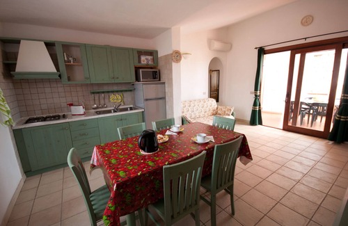 Monte Petrosu Apartment | Nice apartment with roof terrace in an elegant complex with swimming pool