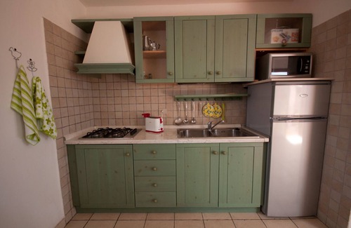 Monte Petrosu Apartment | Nice apartment with roof terrace in an elegant complex with swimming pool