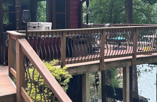 Livingston House | "No Wake Zone" with large dock, covered slip, and diving platform.