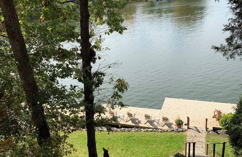 Livingston House | "No Wake Zone" with large dock, covered slip, and diving platform.