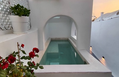 Pyrgos Villa | Noir Cave Villa in Traditional Settlement w/Private Hot Tub & Sunset Terrace!