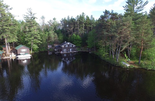 Rainbow Lake House | None Closer to the Water's Edge. One of a kind BOATHOUSE