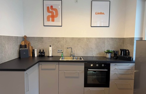 Neudorf-Nord Apartment | NOOQA: The Orange Harmony - Design Apartment - Parking, Balcony, TV, Nespresso