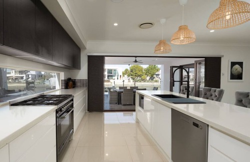 Biggera Waters House | North Quay Waterfront Family Holiday Home + Pool