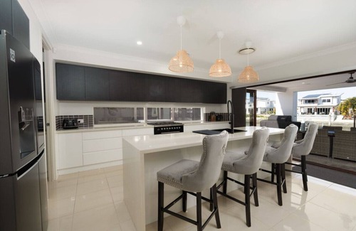 Biggera Waters House | North Quay Waterfront Family Holiday Home + Pool