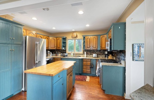 Wolverine Lake House | Oak Island: Waterfront Bliss with Hot Tub and Sandy Beach