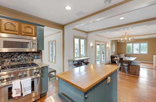 Wolverine Lake House | Oak Island: Waterfront Bliss with Hot Tub and Sandy Beach