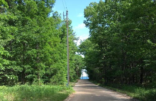 Beaver Island Condo | Oak Woods Lodge Unit 7. Quiet setting in the woods, but close to town.