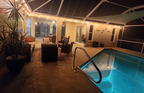 Pelican House | Oasis: 3-bedroom house with POOL and beautiful Screened back patio in Cape Coral