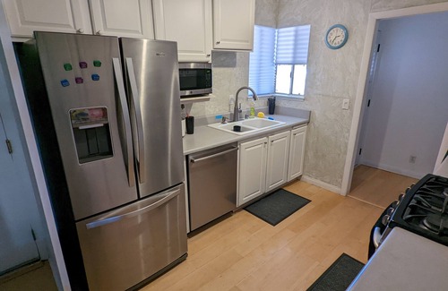 Paradise House | OASIS Pool & Spa Vacation House. 10 minutes from strip & airport. Sleeps 12.