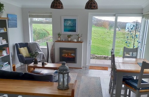 Ventry Cottage | Ocean Blue Retreat; stunning harbourviews, quiet rural setting near Dingle town.
