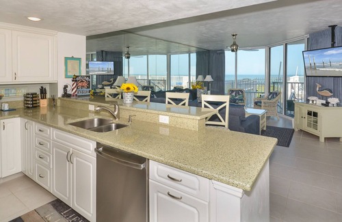 Bethune Beach Condo | Ocean Condo 104 ~ Ground Floor Corner Condo with wrap around balcony! Walk right out to Pool!