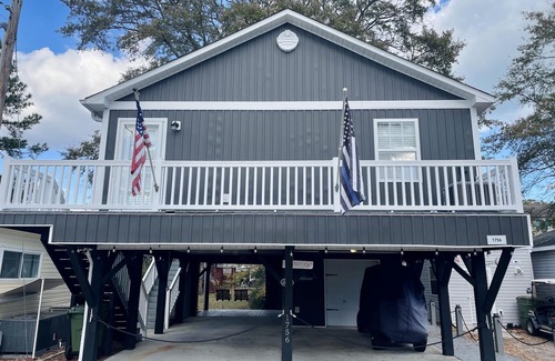 Surfside Beach House | Ocean Lakes -Site 1756 Outdoor seating area w/firepit. Serene canal views!