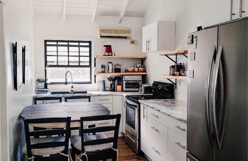 Cockburn Town Villa | Ocean View, Beach Access, New Smart House, Your Stay Donates to Animal Welfare ,