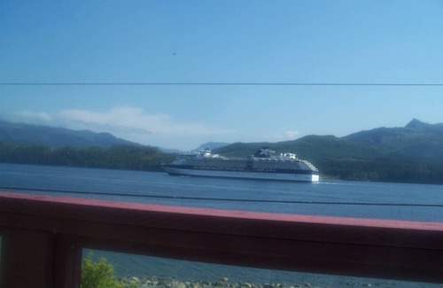Alert Bay Bed & Breakfast | Ocean View Log Lodge with queen bed. Hot breakfast included.