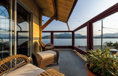 Alert Bay Bed & Breakfast | Ocean View Log Lodge with queen bed. Hot breakfast included.