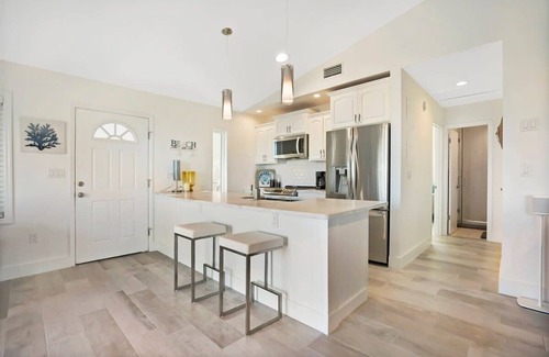 Butler Beach Apartment | Ocean Views, Beach Bikes, Sunny Deck, Steps 2 Sand