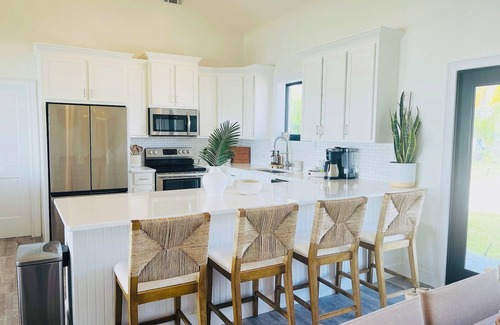 Treasure Cay House | Oceanfront 5-bedroom 3-bath house with 50' Dock & optional 6 seater golf cart