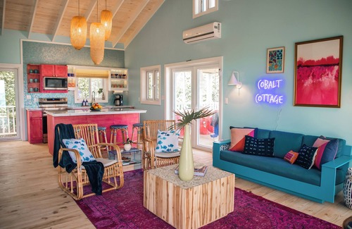 Dunmore Town Cottage | Oceanfront Cobalt Cottage- rooftop deck, generator, slide, & daybed swing!