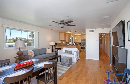 Townsite Condo | OCEANSIDE BEACH located by pier and marina! Ocean Views! Walk to Village!