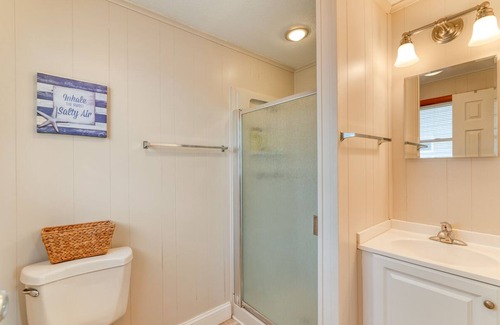 Ocean Isle Estates House | Oceanside cottage just a short walk to the beach with a community pool!