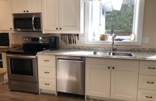 Clam River Cottage | ON TORCH LAKE SANDY BEACH COTTAGE HOME! AMAZING SUNSETS! LARGE YARD JUST OPENED
