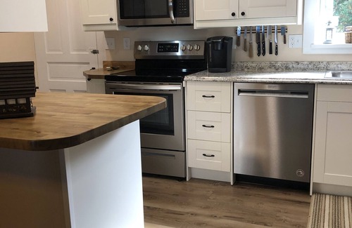 Clam River Cottage | ON TORCH LAKE SANDY BEACH COTTAGE HOME! AMAZING SUNSETS! LARGE YARD JUST OPENED