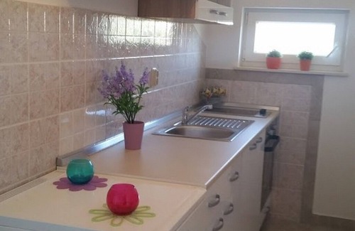 Kolan Apartment | One bedroom apartment with terrace and sea view Kolan, Pag (A-16482-a)