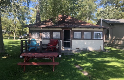 Traverse City Cabin | One-bedroom cabin on Lake Leelanau. Sunset view. Pet considered.