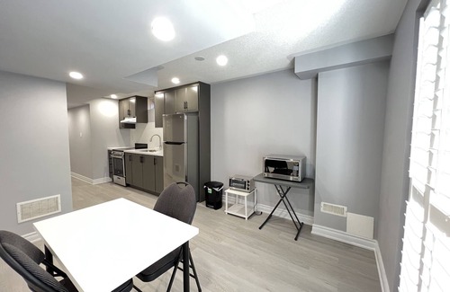 Meadowvale Village House | One bedroom ensuite toilet on main level & kitchen, living, bathroom lower level