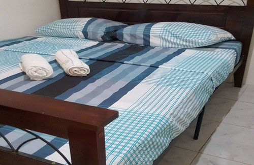 Puerto Princesa City Centre House | One Bedroom village House Close to Beaches