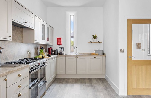 Paignton House | One of 3 cottages, this beautiful barn conversion with a hot tub and EV charger is the perfect place