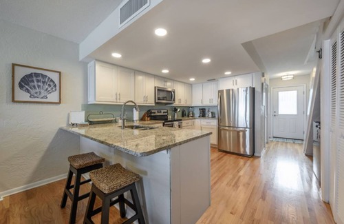Indian Rocks Beach Condo | One step and you are on the BEACH! Watch AMAZING sunsets from 3 decks!