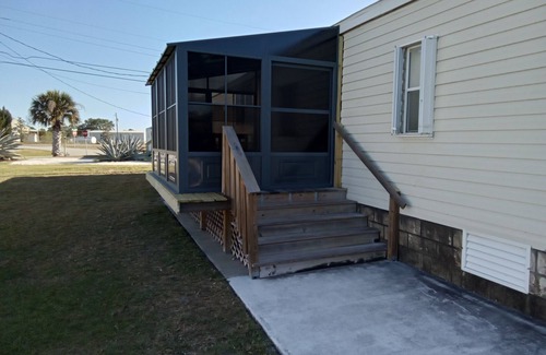 Sebastian House | Open and inviting home with screened in porch.