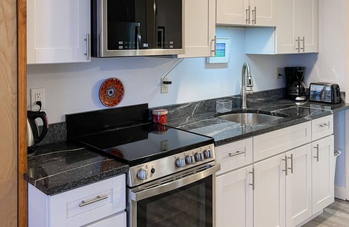 Wells Condo | Open, ground-floor condo right in town with outdoor pool, BBQ
