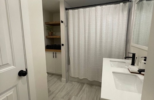 North Glenmore Bed & Breakfast | Orchard Oasis - Spacious with Modern Comforts, Heated Floors, 65" TV