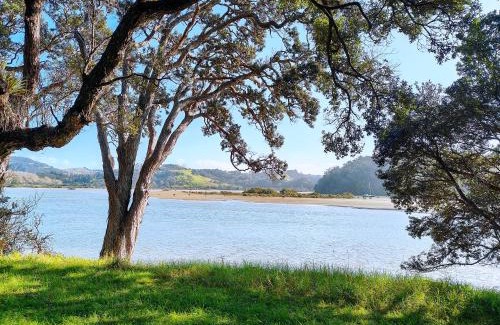 Orewa House | Orewa family holiday house with 3 bed-rooms view on deck near cafe, bush & river