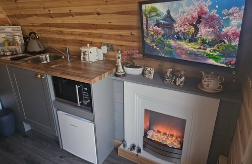 Swaffham Cabin | Oriental Garden Pod. Set in our gorgeous garden of bonsai, pagoda and koi pond.