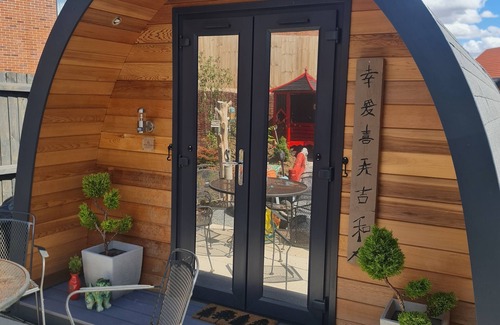 Swaffham Cabin | Oriental Garden Pod. Set in our gorgeous garden of bonsai, pagoda and koi pond.