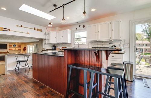 Oshkosh House | Oshkosh Canal-Front Home w/Sunroom & Watercraft!