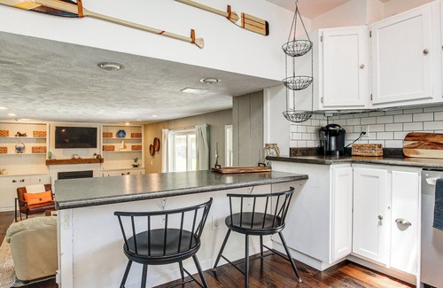 Oshkosh House | Oshkosh Canal-Front Home w/Sunroom & Watercraft!