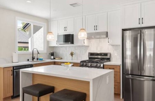 The Plaza House | Ostrom · Modern heated pool&spa + 5 mi to beach