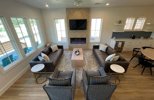 Carlton Landing House | Outdoor perfection: 3 porches with park views, turf backyard, easy walk to pool